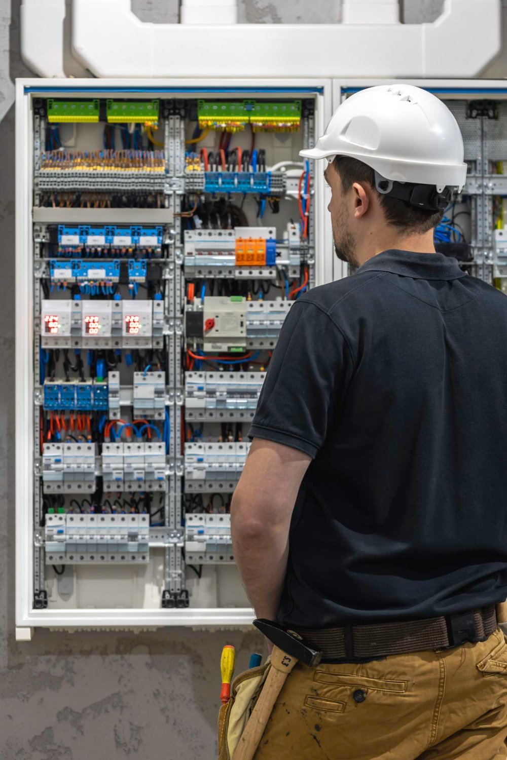 Engineer inspecting an electrical panel
